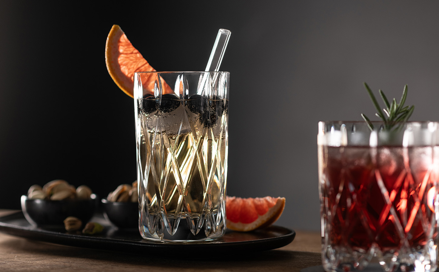 Age Longdrinkglas mit Orange garniert